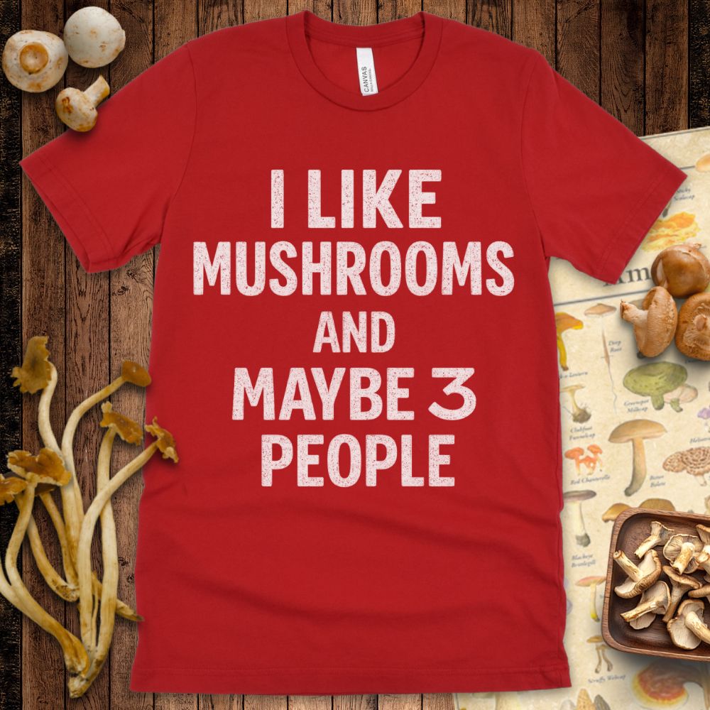 Black T-shirt design with bold white text that says “I like mushrooms and maybe 3 people”