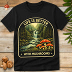 Vintage style forest waterfall landscape with red spotted mushrooms and text “Life Is Better With Mushrooms”.