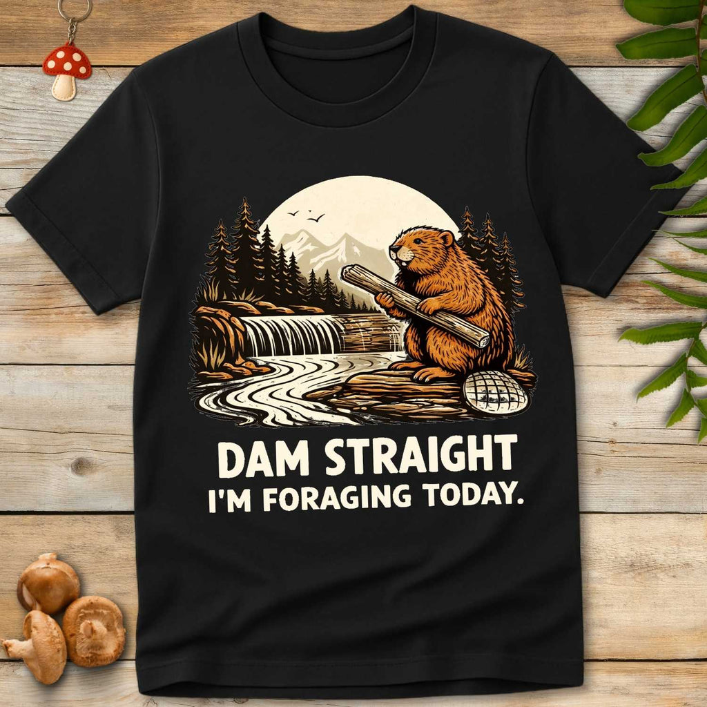 Vintage style illustration of a beaver holding a log by a river dam with mountains and pine trees, reading “Dam Straight I’m Foraging Today”.