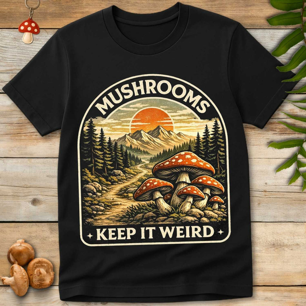 Vintage style illustration of mushrooms with mountain landscape and sunset reading “Mushrooms Keep It Weird”
