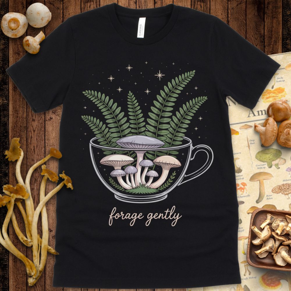 Whimsical illustration of a teacup filled with mushrooms, ferns, and stars, with the phrase “forage gently” beneath in soft handwritten script.