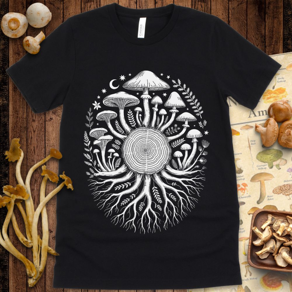 Intricate mandala-style illustration of mushrooms and roots radiating from a central tree ring with stars, moons, and leaves on a black background