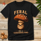 Vintage-style angry mushroom character with fangs beneath the phrase "Feral Like a Carnivorous Fungi" on a black background.