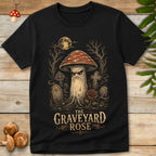 Vintage-style illustration of a stern red-capped mushroom standing in a moonlit graveyard with tombstones, twisted trees, and a blooming graveyard rose.