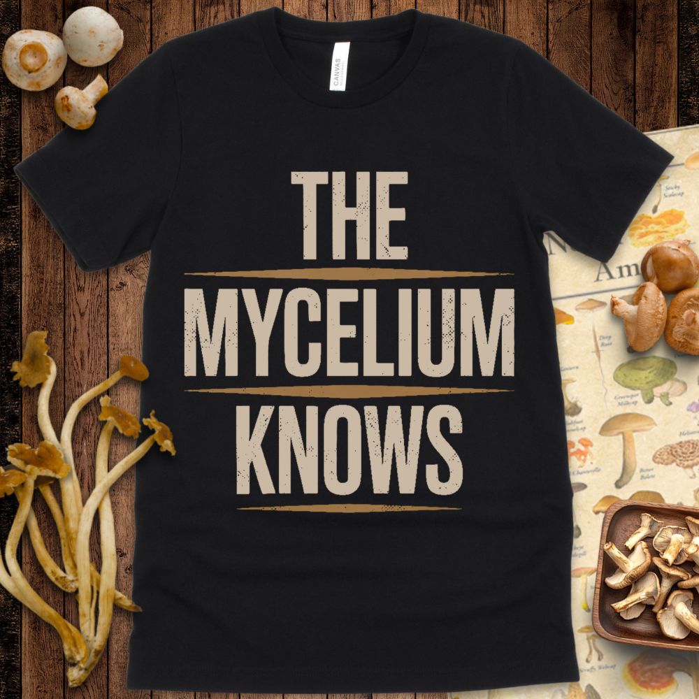 Bold block text design reading “The Mycelium Knows” with horizontal accent lines and a vintage distressed look on a black background.
