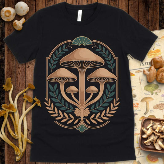 Ornate golden-brown mushrooms framed by laurel leaves with art deco accents on a graphic tee