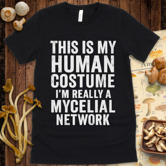 Graphic tee with bold text reading “This Is My Human Costume – I’m Really a Mycelial Network” for mushroom lovers and humor fans