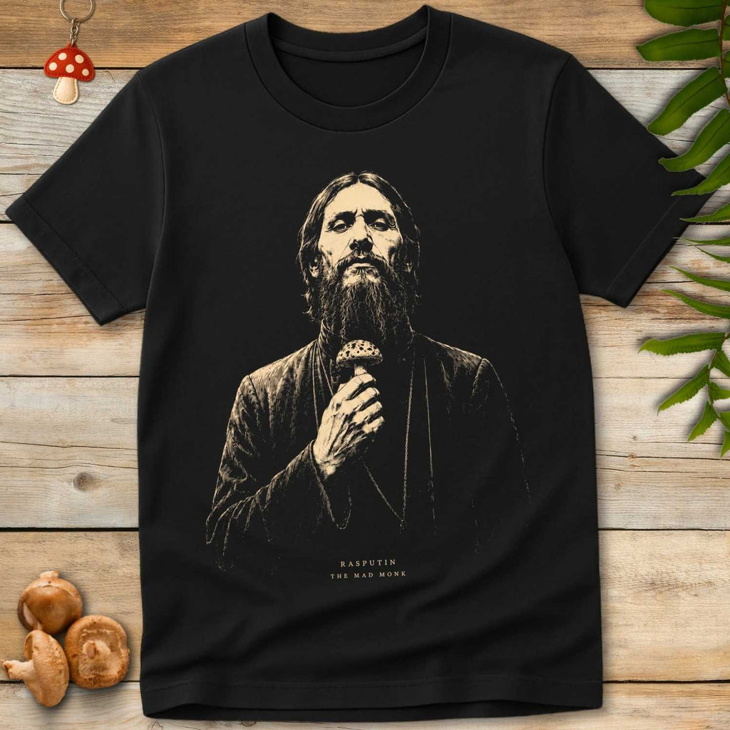 Vintage-style illustration of Rasputin the Mad Monk holding a spotted mushroom on a black background graphic t-shirt design.