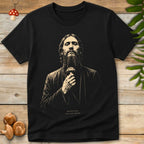 Vintage-style illustration of Rasputin the Mad Monk holding a spotted mushroom on a black background graphic t-shirt design.