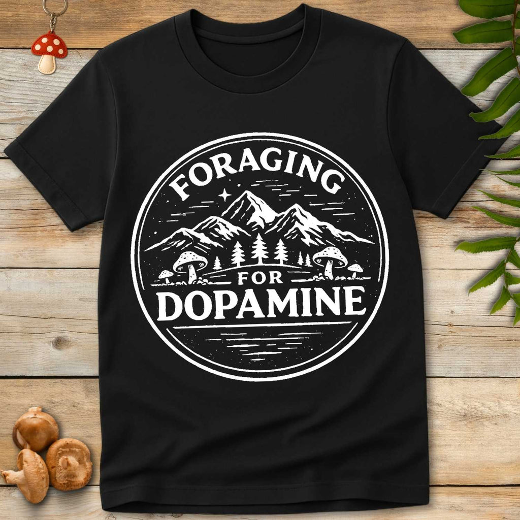 Vintage circular badge design reading “Foraging for Dopamine” with mountains, pine trees, and mushrooms.