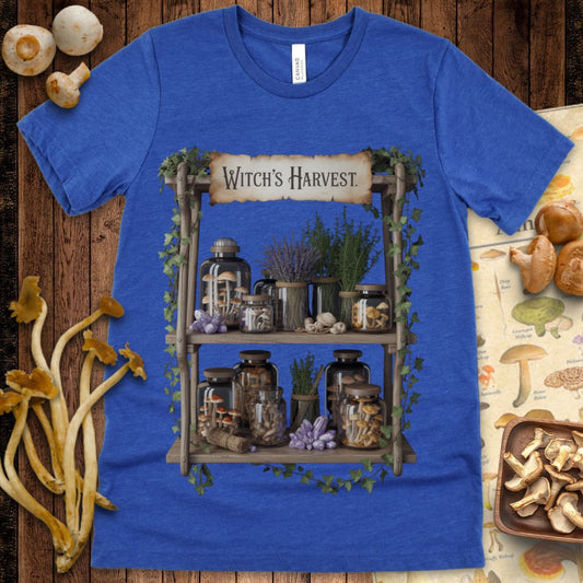Witch’s Harvest design featuring jars of mushrooms, herbs, and crystals on a wooden shelf wrapped in ivy, evoking a magical apothecary aesthetic.