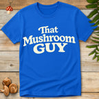 Retro style typography reading “That Mushroom Guy” in a bold cream font on a blue shirt 