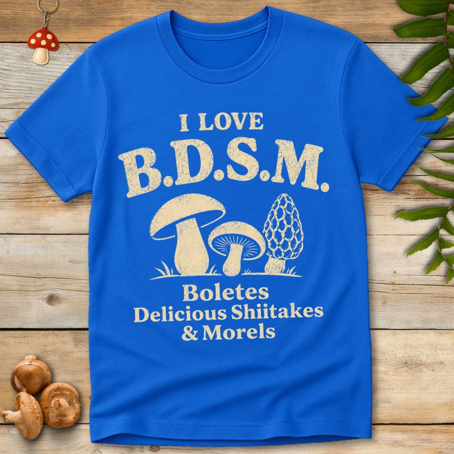 Love BDSM Tee featuring vintage mushroom illustrations with the phrase “I Love B.D.S.M. Boletes Delicious Shiitakes & Morels.”