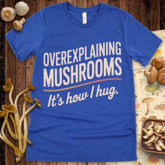 Distressed cream and gradient text on black reading “Overexplaining Mushrooms — It’s how I hug” with curved underline design