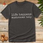 Minimalist white text on grey background reading “life happens mushrooms help” in a vintage typewriter font.