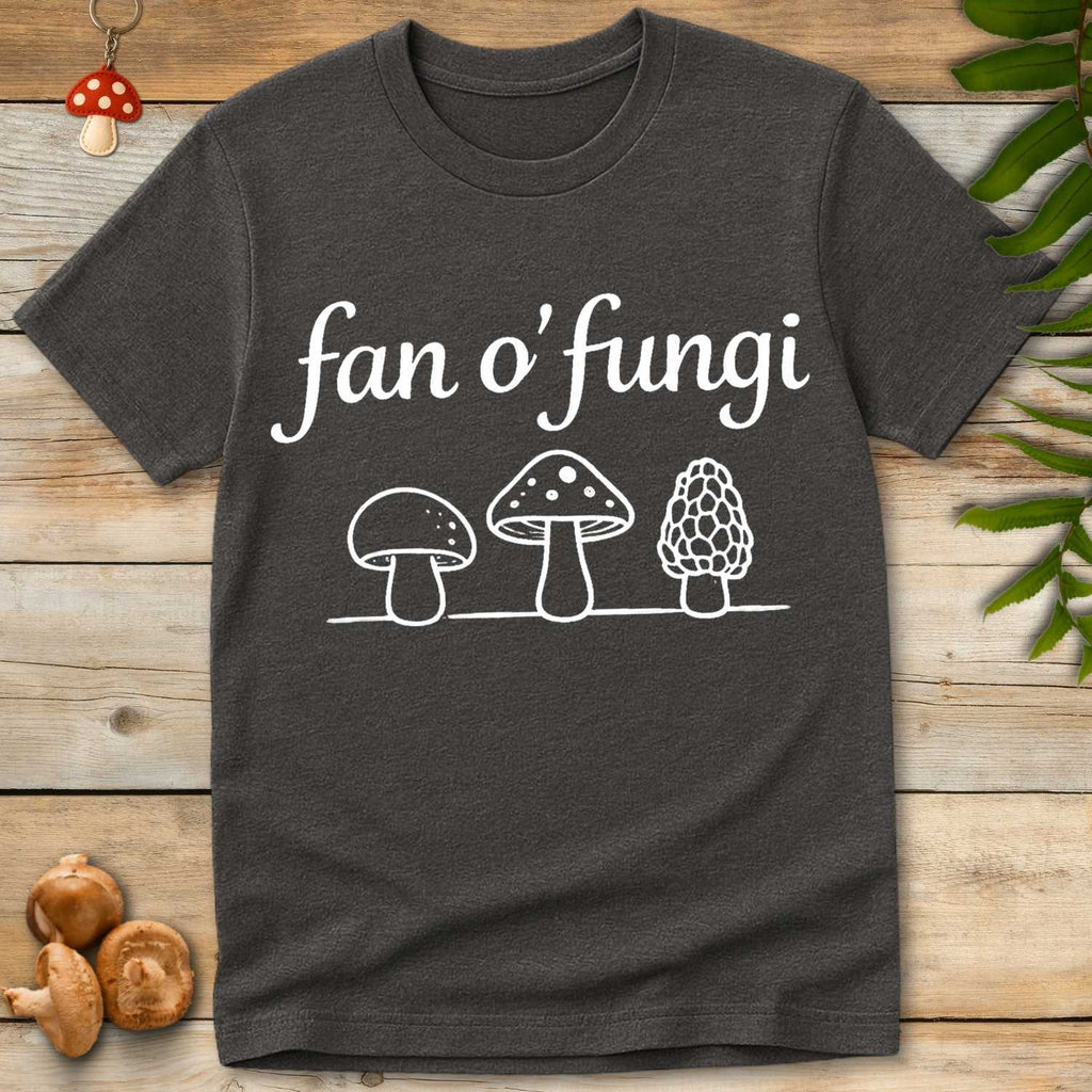 Gray T-shirt with white script text “fan o’ fungi” above line drawings of three different mushrooms