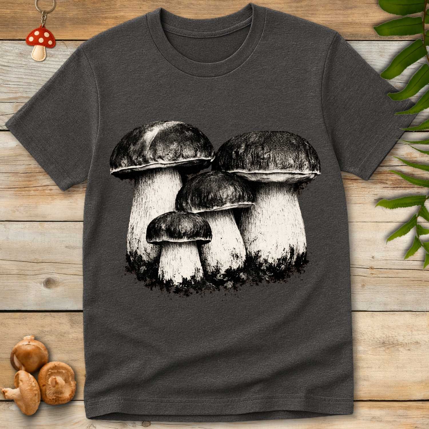 Grunge-style illustration of a cluster of porcini mushrooms with textured caps and thick stems on a dark background