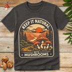 Vintage style design with red mushrooms, forest trees, canyon landscape, and sunset with text “Keep It Natural With Mushrooms”