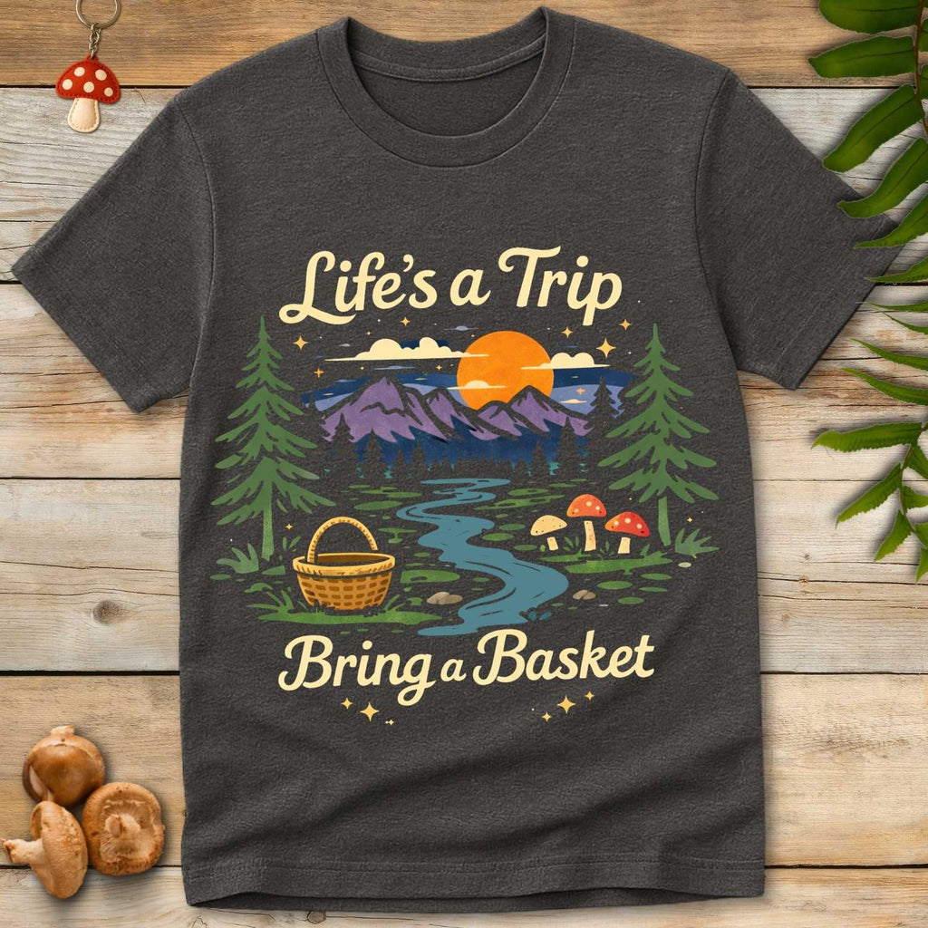 Retro forest landscape with mountains, sunset, mushrooms, and a foraging basket with the phrase “Life’s a Trip Bring a Basket”.