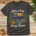 Retro forest landscape with mountains, sunset, mushrooms, and a foraging basket with the phrase “Life’s a Trip Bring a Basket”.