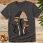 Boho Matisse style mushroom illustration featuring tall neutral-toned fungi in tan, brown, black, and cream with minimalist botanical leaves on a shirt.