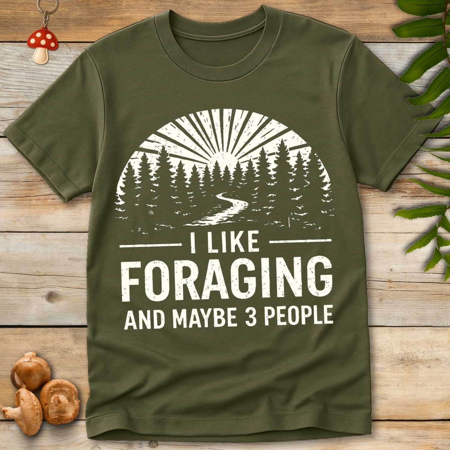 Vintage forest scene with pine trees and a winding trail reading “I Like Foraging and Maybe 3 People”.