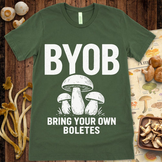 T-shirt design with large “BYOB” text and three illustrated bolete mushrooms underneath the phrase “Bring Your Own Boletes”