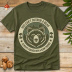 Circular design with a grizzly bear, mushrooms, and forest background, featuring the text “You Can’t Outrun a Bear – Always Forage with a Slow Friend.”