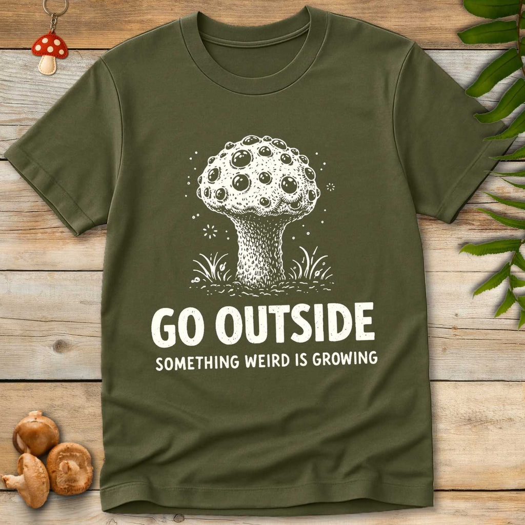 Vintage style mushroom illustration with the phrase “Go Outside Something Weird Is Growing”.