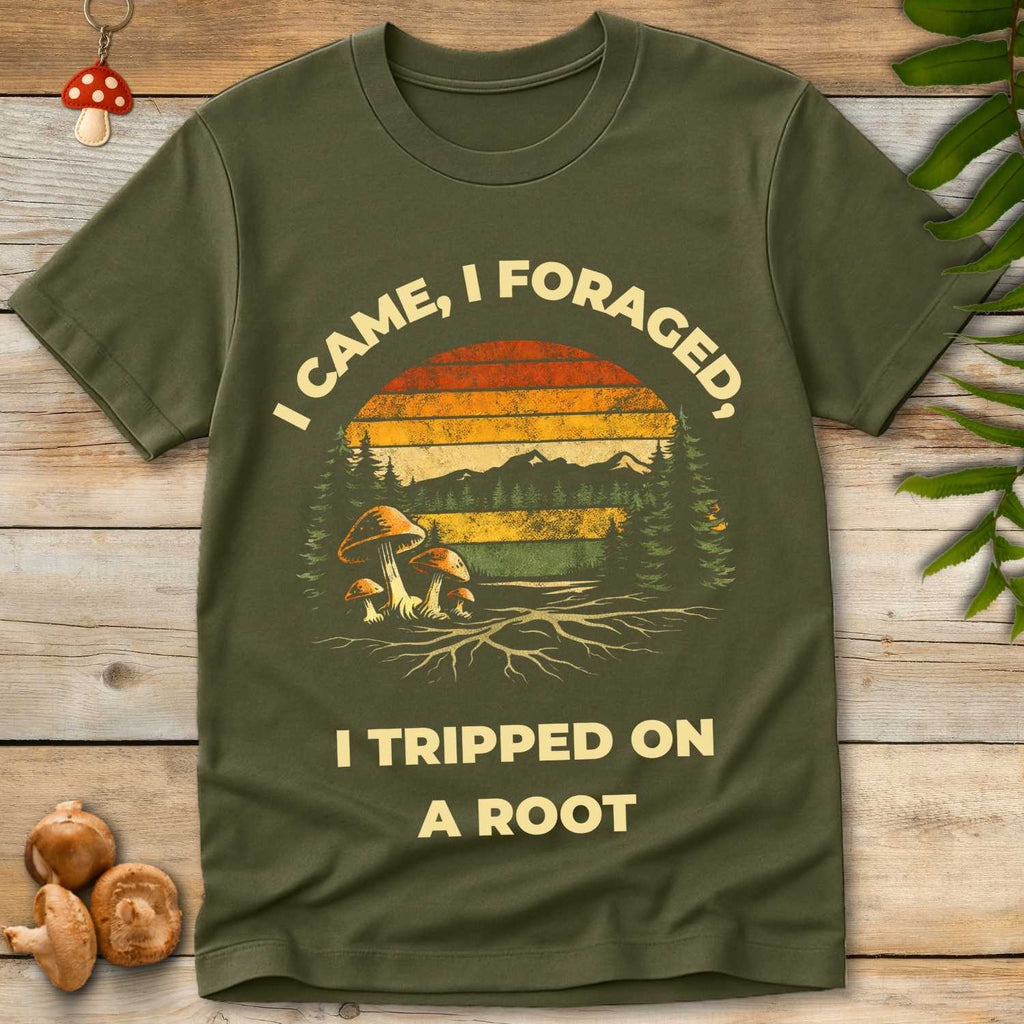 Retro-style graphic tee with mushrooms, trees, sunset, and the text “I came, I foraged, I tripped on a root”