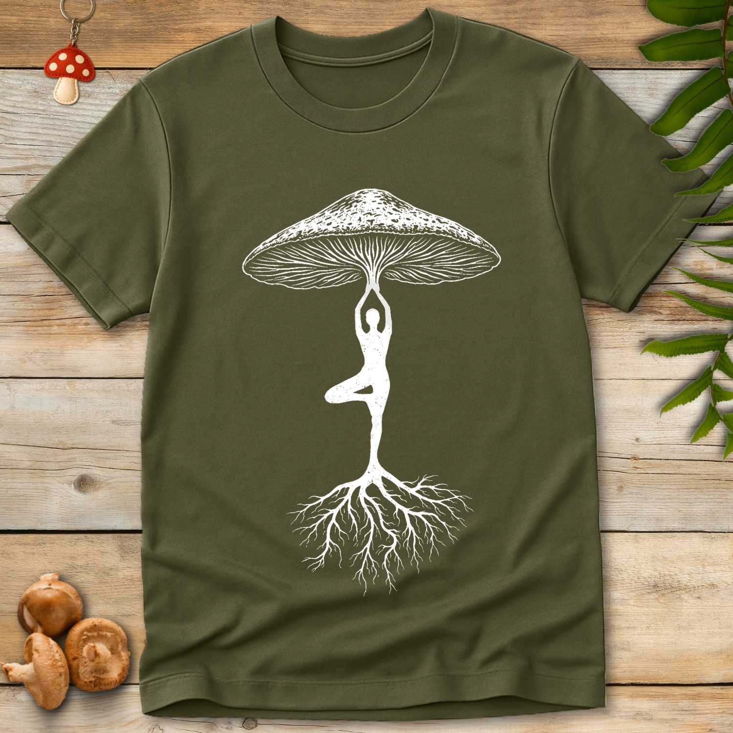 Illustration of a person in a yoga tree pose forming the stem of a mushroom with detailed gills above and mycelium roots below.
