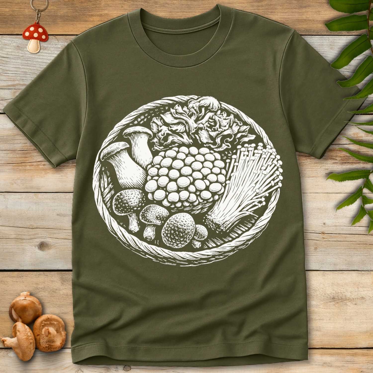 Detailed black and white illustration of a woven basket filled with assorted mushrooms including oyster, enoki, and clustered fungi.