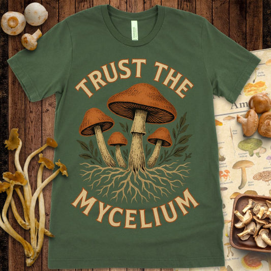 Illustrated cluster of orange mushrooms with branching mycelium roots and leafy accents, featuring the phrase "Trust the Mycelium" in bold vintage font.