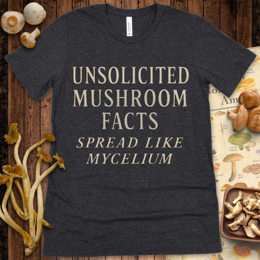 Typography T-shirt design with the phrase "Unsolicited Mushroom Facts Spread Like Mycelium" in cream-colored serif text on black background
