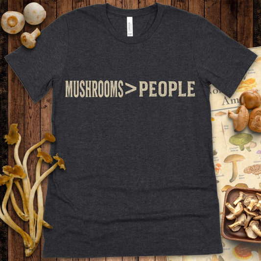 Distressed graphic t-shirt design with the phrase "Mushrooms > People" in bold vintage-style lettering