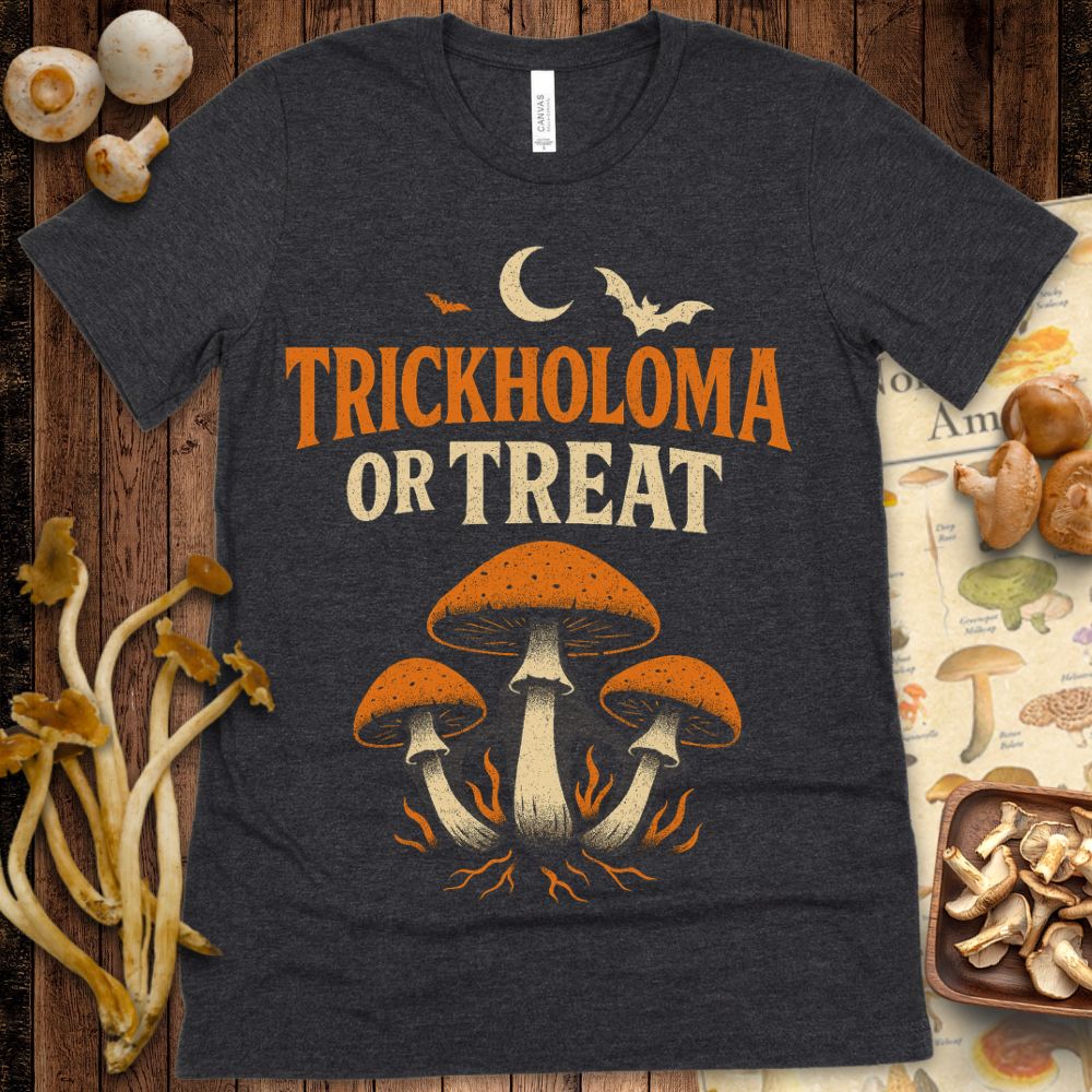 Halloween mushroom shirt featuring three mushrooms under a crescent moon with bats and the phrase “Trickholoma or Treat” in vintage orange on black.