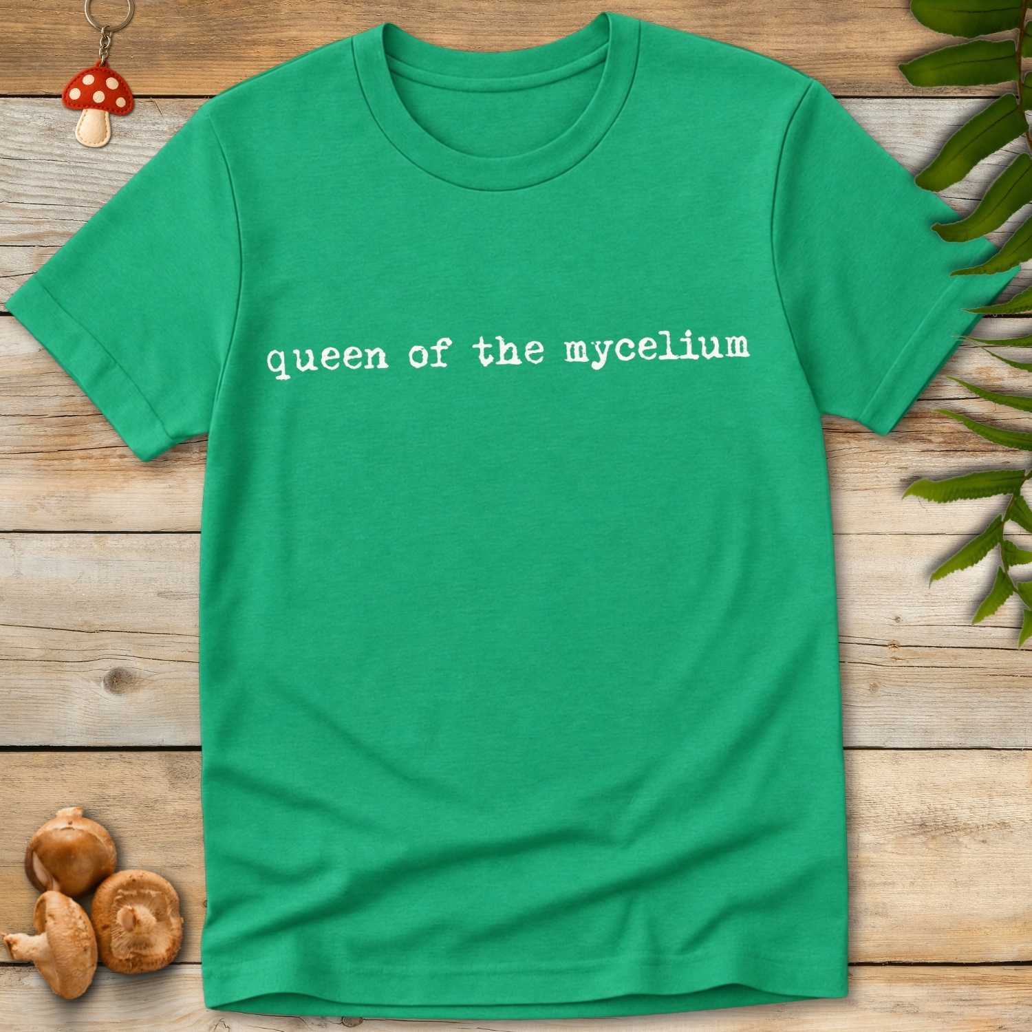 Queen Mycelium Tee featuring minimalist vintage typography reading “queen of the mycelium” on a black background.