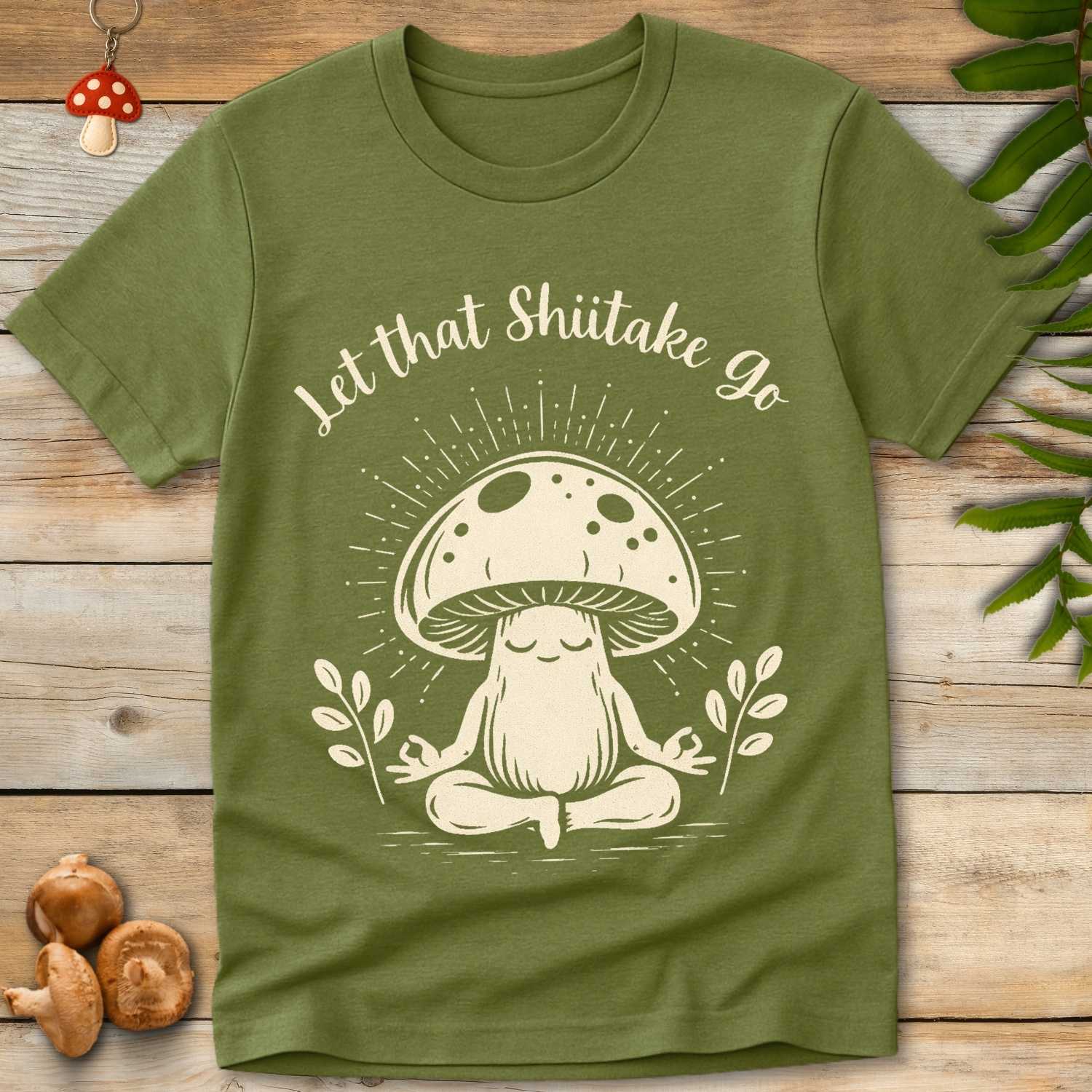 Meditating mushroom character with the phrase “Let that Shiitake Go” in whimsical script, radiating peaceful energy