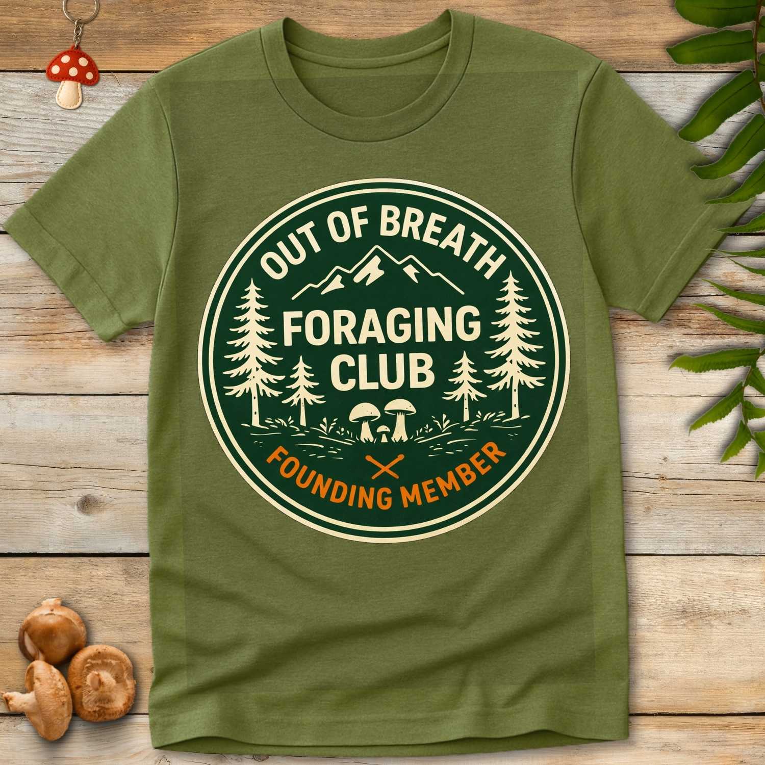 Circular badge-style graphic with mushrooms, pine trees, and mountains, featuring the text “Out of Breath Foraging Club – Founding Member”