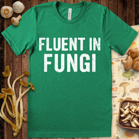 “Fluent in Fungi” bold text graphic tee for mushroom lovers and mycology fans