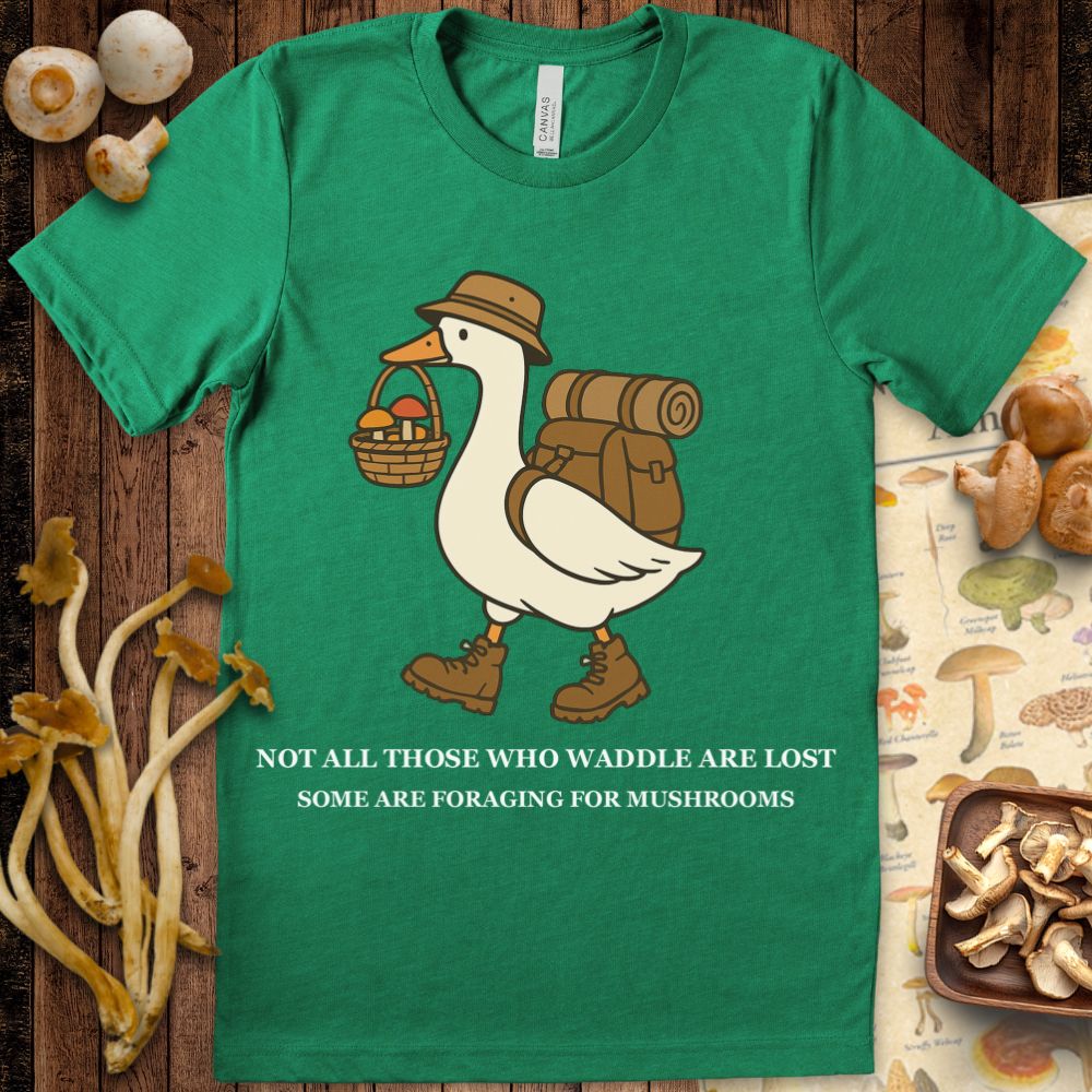 Cartoon duck wearing hiking gear and carrying a basket of mushrooms with the phrase “Not all those who waddle are lost — some are foraging for mushrooms.”