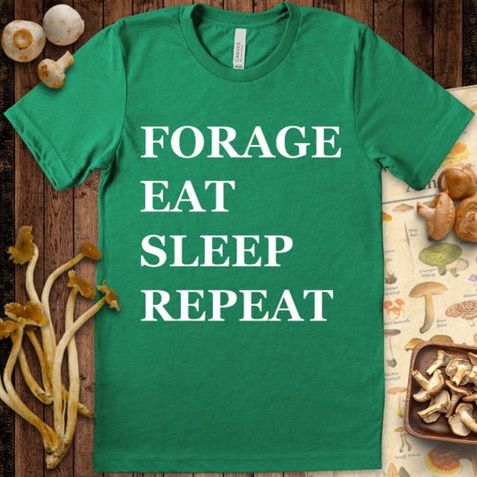 Black t-shirt with bold white text reading “Forage, Eat, Sleep, Repeat” in all caps.