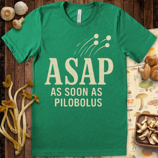 T-shirt design with “ASAP – As Soon As Pilobolus” text and a graphic of spores launching from a mushroom on Lite Green background