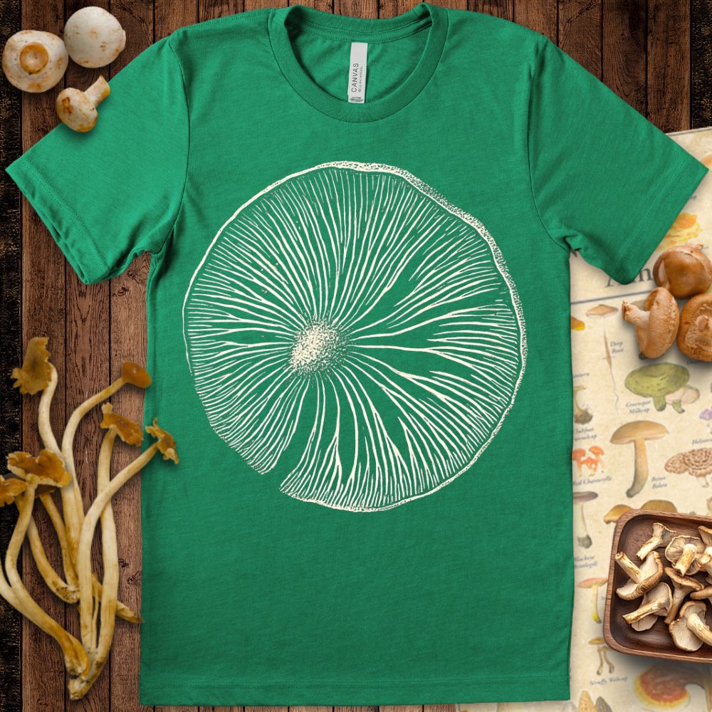 Vintage-style illustration of a mushroom spore print with detailed gills in white on a black background