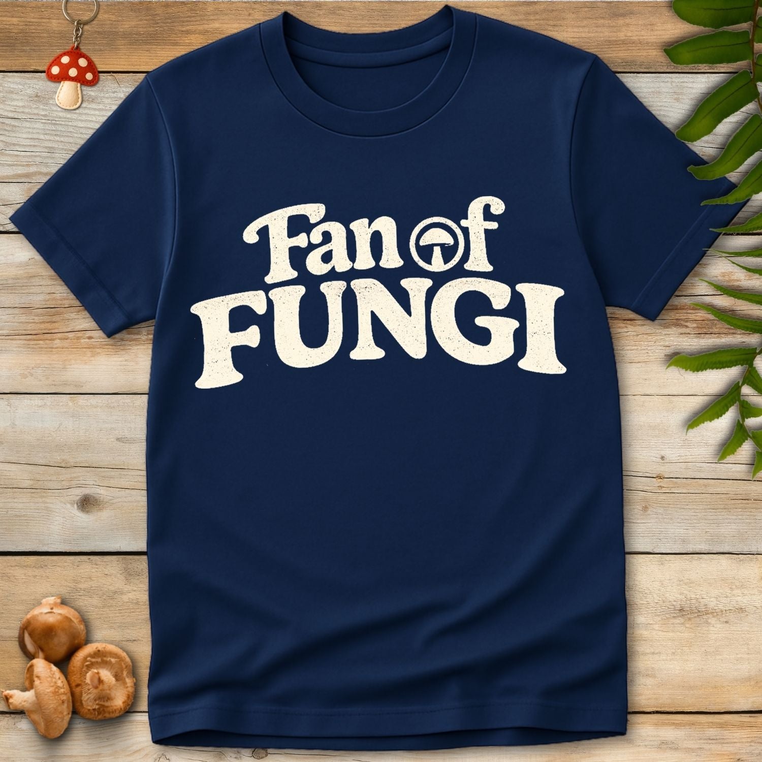 Bold vintage typography reading “Fan of Fungi” with a small mushroom icon incorporated into the design