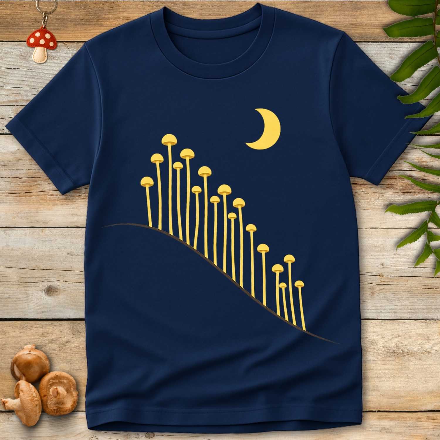 Golden mushrooms growing along a curved hillside beneath a crescent moon on a navy background, minimalist moonlit forest design.