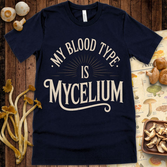 “My Blood Type Is Mycelium” vintage-style graphic tee with bold lettering and sunburst design for mushroom lovers