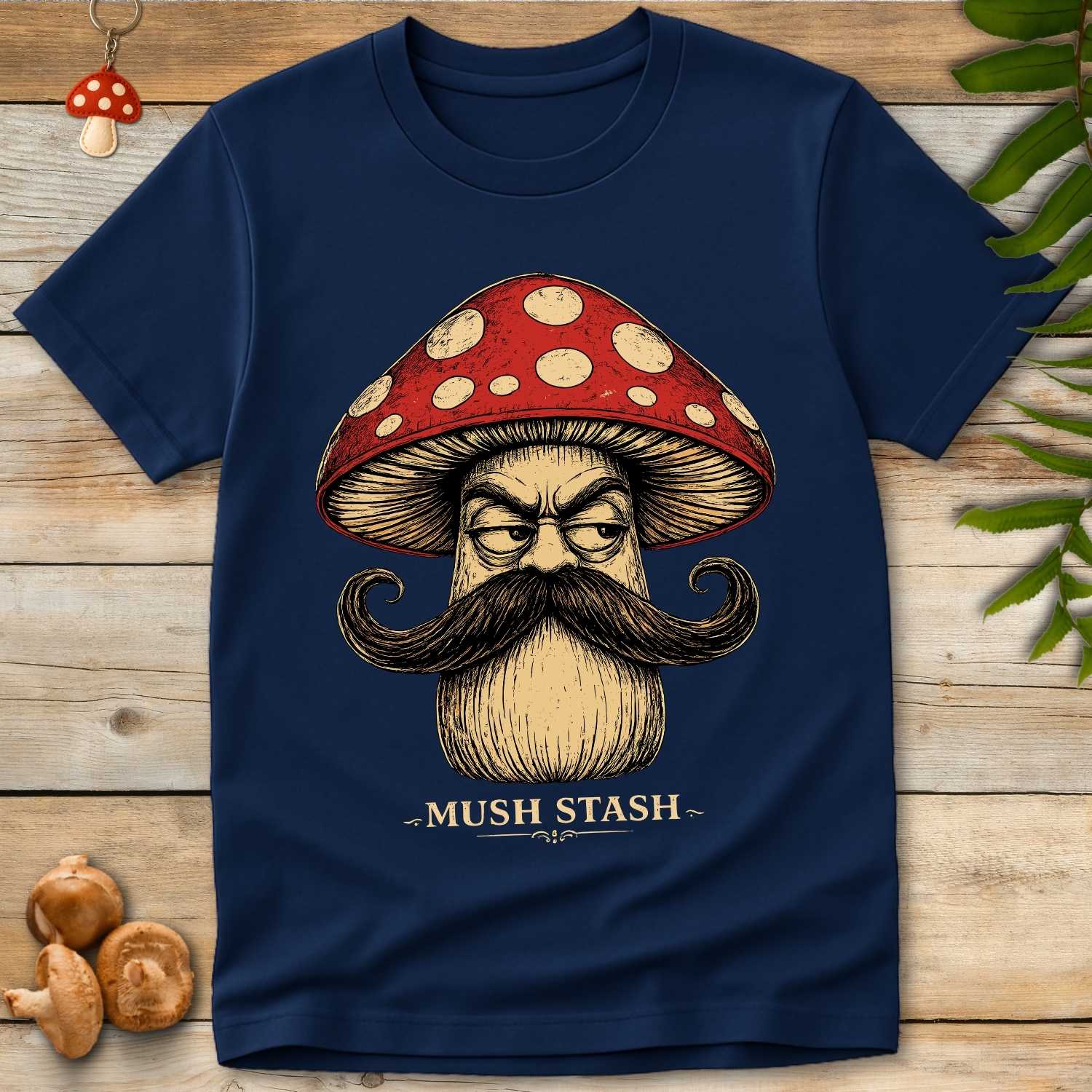 Vintage-style mushroom character with a large curled mustache, red spotted toadstool cap, and the text "Mush Stash" on a black background.