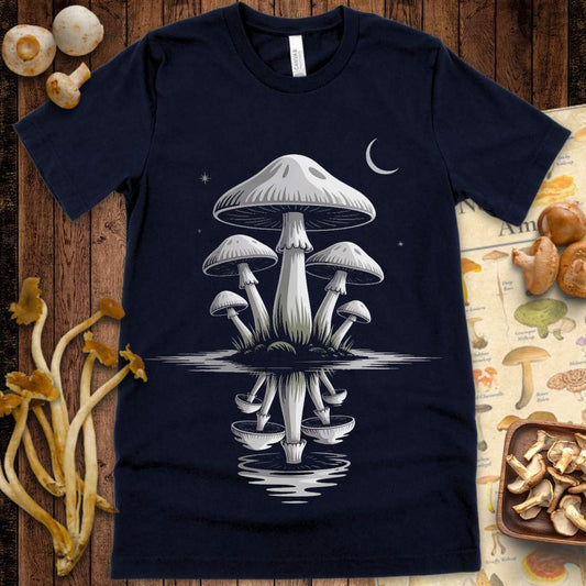 Moonlit mushrooms reflected in dark water beneath a crescent moon and stars on a graphic tee