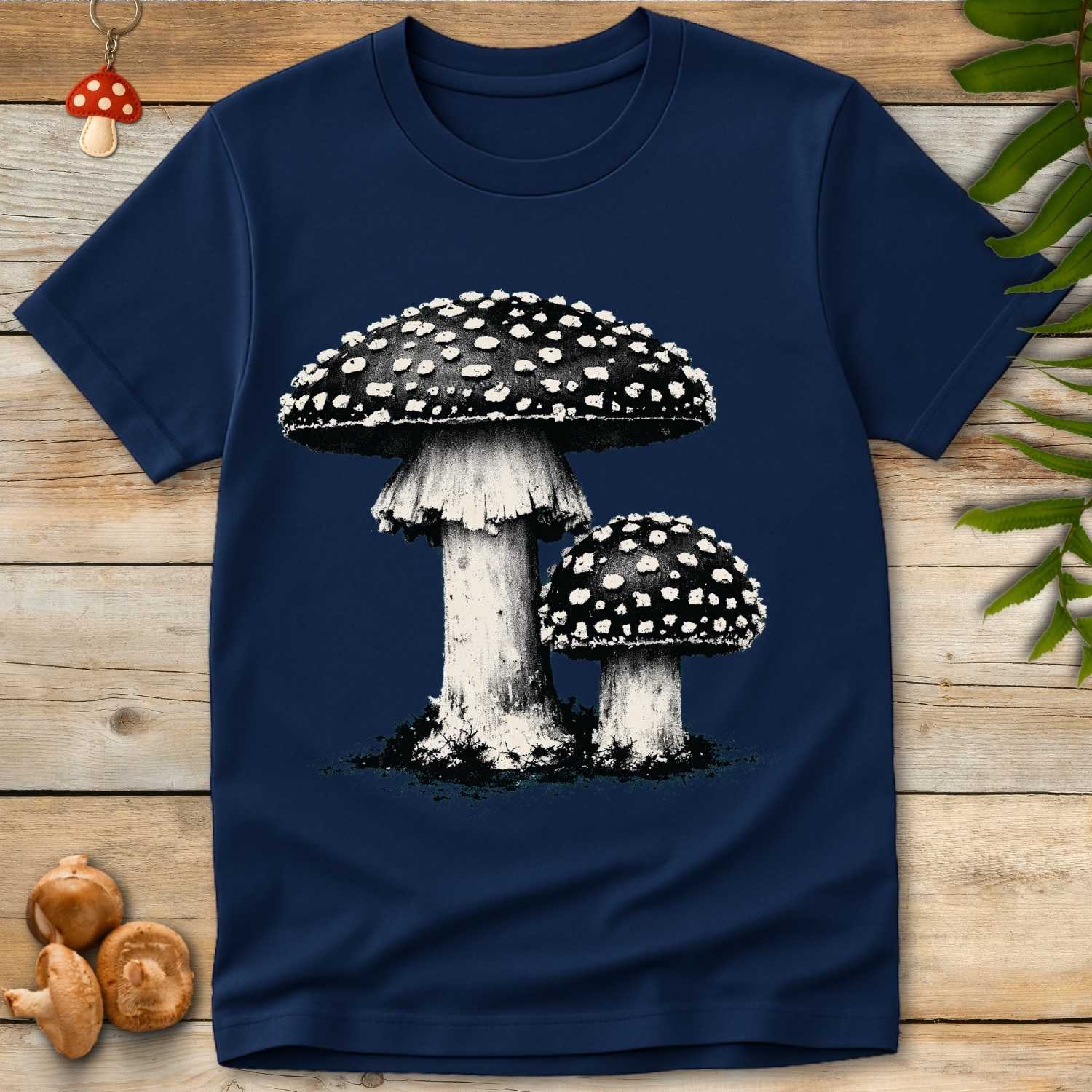 Grunge-style illustration of two Amanita muscaria mushrooms with spotted caps on a distressed background